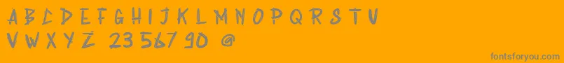 Fonte Rabsy Free Demo – fontes cinzas em um fundo laranja