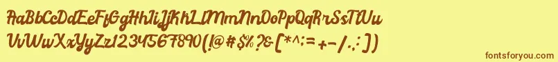 Fonte Rachael Script – fontes marrons em um fundo amarelo