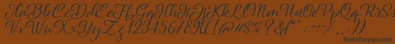 Rachella Font – Black Fonts on Brown Background