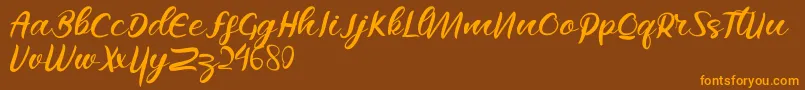 Raflesya Font – Orange Fonts on Brown Background