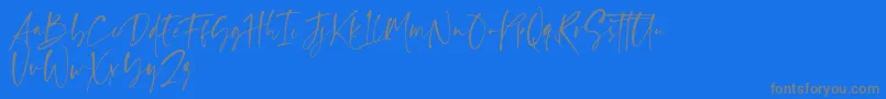 Ragland Font – Gray Fonts on Blue Background