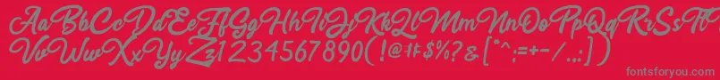 Fonte Rahayu Script – fontes cinzas em um fundo vermelho