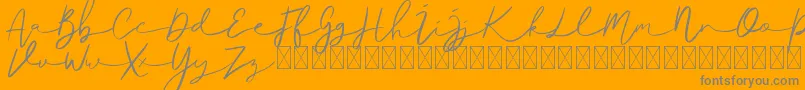 Ralisto-Schriftart – Graue Schriften auf orangefarbenem Hintergrund