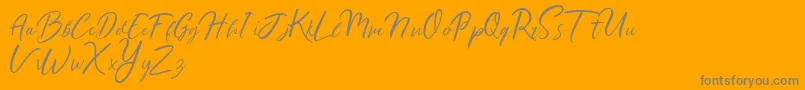 Ralyne Demo-Schriftart – Graue Schriften auf orangefarbenem Hintergrund