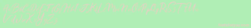 Ralyne Demo-Schriftart – Rosa Schriften auf grünem Hintergrund