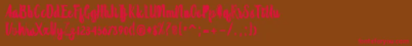 Randoem Brush-Schriftart – Rote Schriften auf braunem Hintergrund