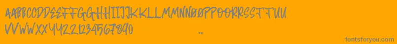 Random Brush-Schriftart – Graue Schriften auf orangefarbenem Hintergrund