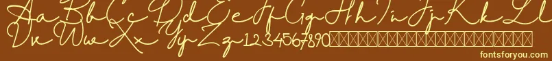 RantcaFreeRegular-Schriftart – Gelbe Schriften auf braunem Hintergrund