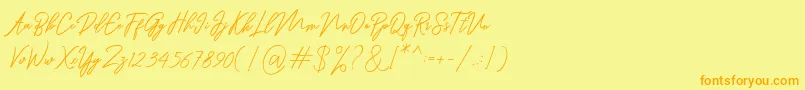 フォントRanuella – オレンジの文字が黄色の背景にあります。