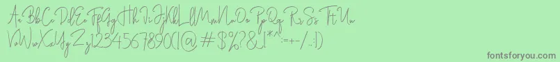 フォントRasendrya – 緑の背景に灰色の文字