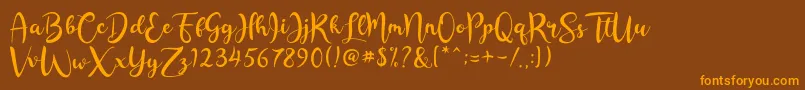 Rashida Script-Schriftart – Orangefarbene Schriften auf braunem Hintergrund
