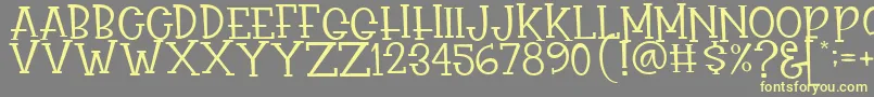 Rasionil Font – Yellow Fonts on Gray Background