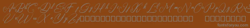 Rasyidin-Schriftart – Graue Schriften auf braunem Hintergrund