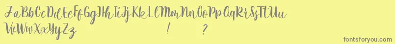 フォントRathyland – 黄色の背景に灰色の文字