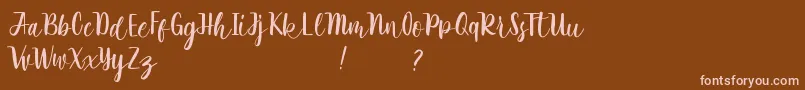Rathyland-Schriftart – Rosa Schriften auf braunem Hintergrund