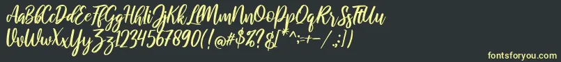 raustila Regular-Schriftart – Gelbe Schriften auf schwarzem Hintergrund
