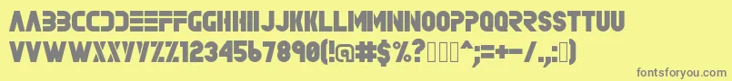 Rave-fontti – harmaat kirjasimet keltaisella taustalla