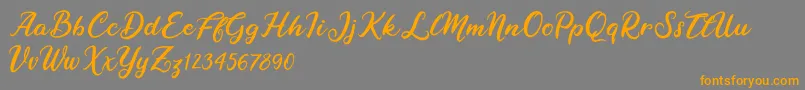 Raybent Mango-Schriftart – Orangefarbene Schriften auf grauem Hintergrund