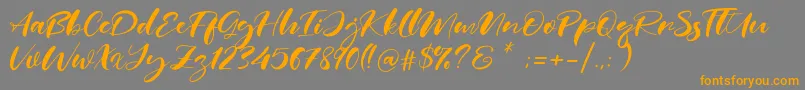 Real Miami-Schriftart – Orangefarbene Schriften auf grauem Hintergrund
