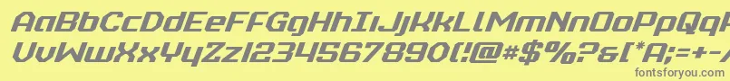 フォントrealpolitikital – 黄色の背景に灰色の文字