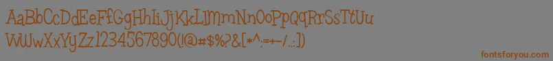 フォントLeftovers – 茶色の文字が灰色の背景にあります。