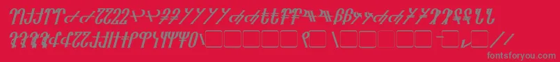 Fonte Reanaarian Bold Italic – fontes cinzas em um fundo vermelho
