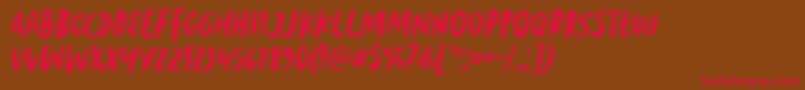 Reborn Revolt Font by 7NTypes Font – Red Fonts on Brown Background