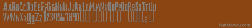 Reckoning-fontti – harmaat kirjasimet ruskealla taustalla