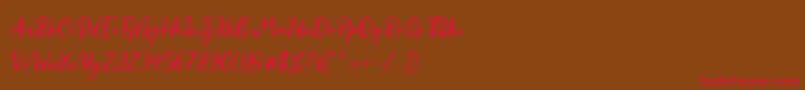 フォントRed Bright Demo – 赤い文字が茶色の背景にあります。