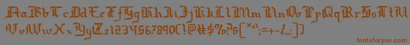 フォントredcoat – 茶色の文字が灰色の背景にあります。