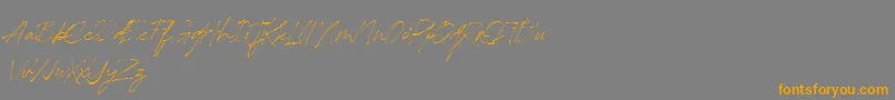 フォントRedstockScript DEMO – オレンジの文字は灰色の背景にあります。