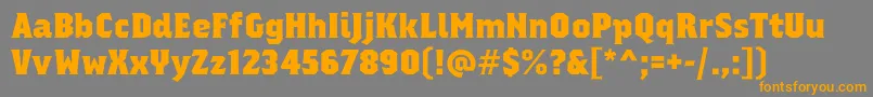 regalia free-Schriftart – Orangefarbene Schriften auf grauem Hintergrund