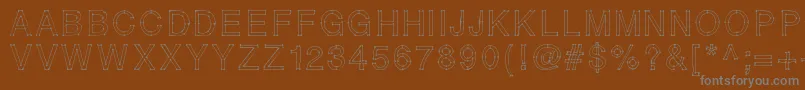 Weitere Informationen zur RELIERLESPOINTS-Schriftart RELIERLESPOINTS-Schriftart – Graue Schriften auf braunem Hintergrund