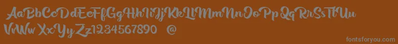 Rentuck Font – Gray Fonts on Brown Background