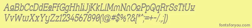 フォントStrsluni – 黄色の背景に灰色の文字
