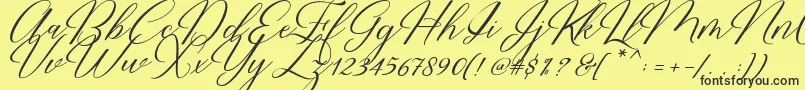 Restiany Script Font – Black Fonts on Yellow Background