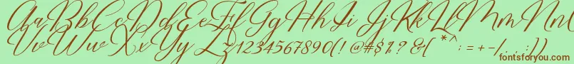 Fonte Restiany Script – fontes marrons em um fundo verde