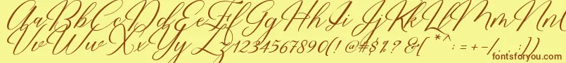 Restiany Script-Schriftart – Braune Schriften auf gelbem Hintergrund