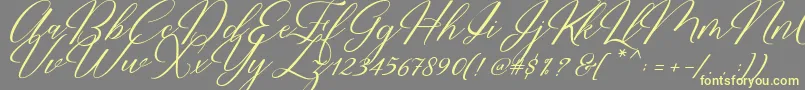 Restiany Script Font – Yellow Fonts on Gray Background