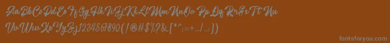 フォントrestyla – 茶色の背景に灰色の文字