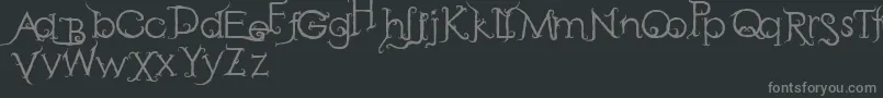 RetakSeribu-fontti – harmaat kirjasimet mustalla taustalla
