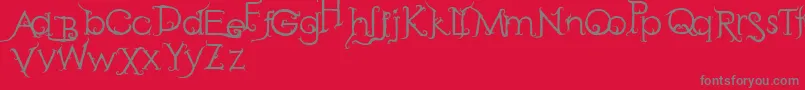 RetakSeribu-fontti – harmaat kirjasimet punaisella taustalla