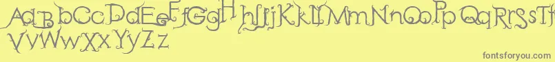 フォントRetakSeribu – 黄色の背景に灰色の文字