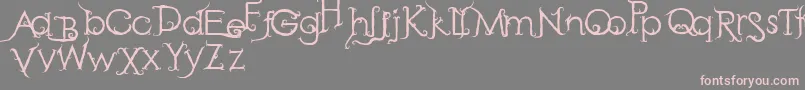 フォントRetakSeribu – 灰色の背景にピンクのフォント