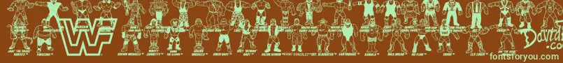 Fonte Retro WWF Hasbro Figures – fontes verdes em um fundo marrom