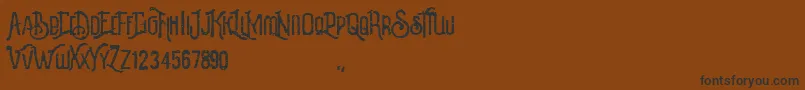 Revalina-fontti – mustat fontit ruskealla taustalla