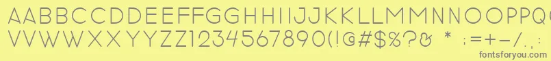 revilo san-fontti – harmaat kirjasimet keltaisella taustalla