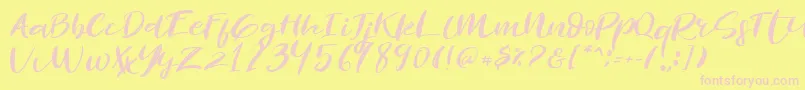 Revolution Brush Font-fontti – vaaleanpunaiset fontit keltaisella taustalla