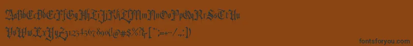 RevolverBlackletter Regular-Schriftart – Schwarze Schriften auf braunem Hintergrund