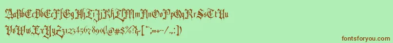 RevolverBlackletter Regular-Schriftart – Braune Schriften auf grünem Hintergrund
